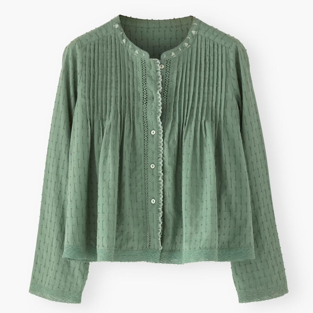 Green textured blouse on a white background